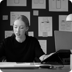female-web-designer-taking-notes-office female-web-designer-taking-notes-office